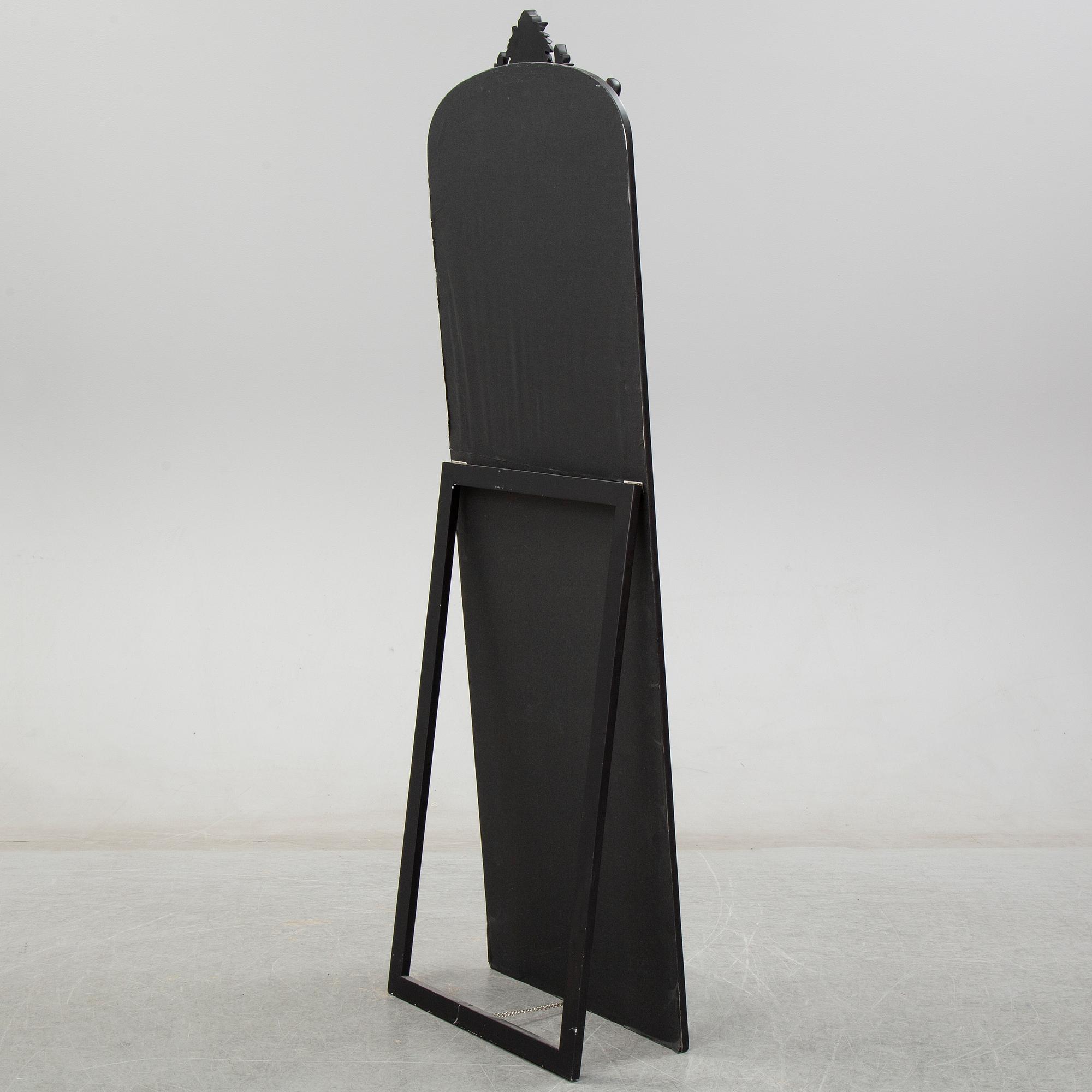 A contemporary floor mirror.