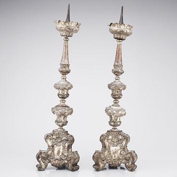 A pair of argente haché Baroque floor candlesticks, presumably Italy 18th century.