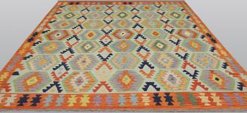 A Kilim carpet, approx. 298 x 258 cm.