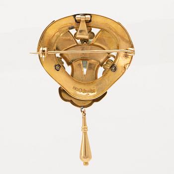 An 18C gold brosch J Pettersson Stockholm 1919 weight 6,2 grams, height 5 cm.
