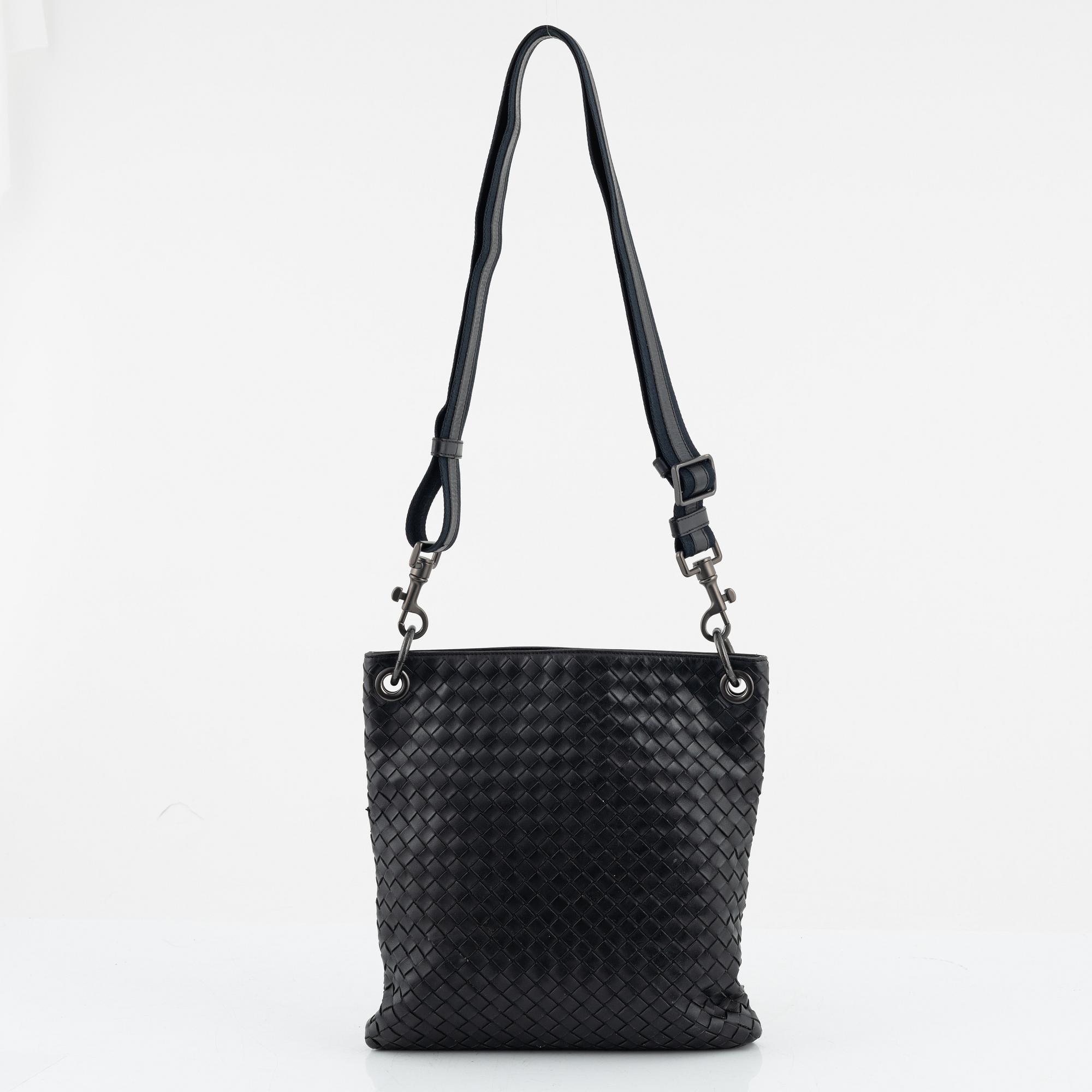 Bottega Veneta, a black intrecciato leather bag.