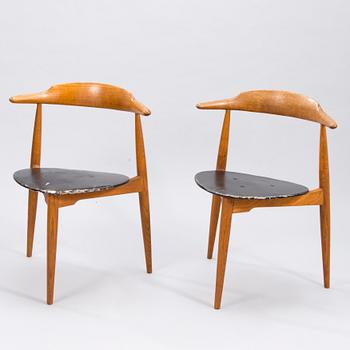 A pair of "Hjertestolen" by Hans J Wegner produced for Fritz Hansen.