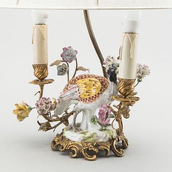 A Meissen porcelain figurine mounted as lamp.