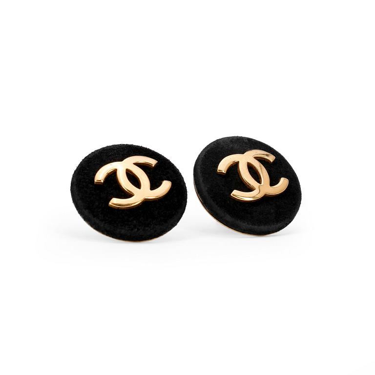 CHANEL, a pair of black suede earclips with CC logo.