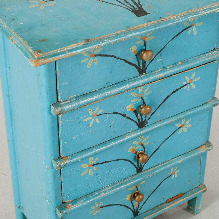 A children's chest of drawers, dated 1937.