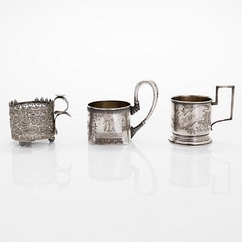 Three silver tea glass holders and four spoons, silver Kostroma and Moscow, late 19th and early 20th centuries.