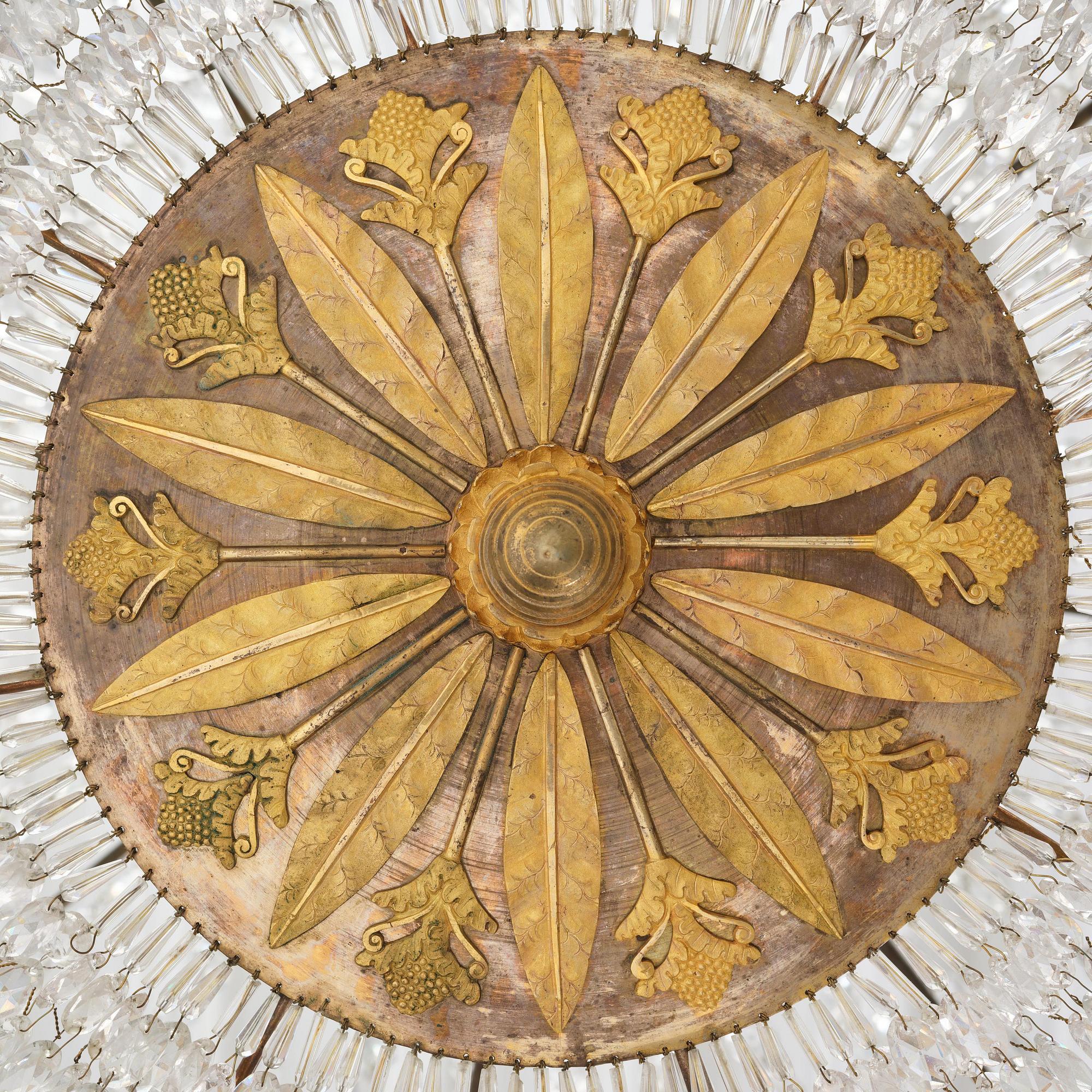 An ormolu and cut glass sixteen-branch Empire chandelier, Paris, early 19th century.