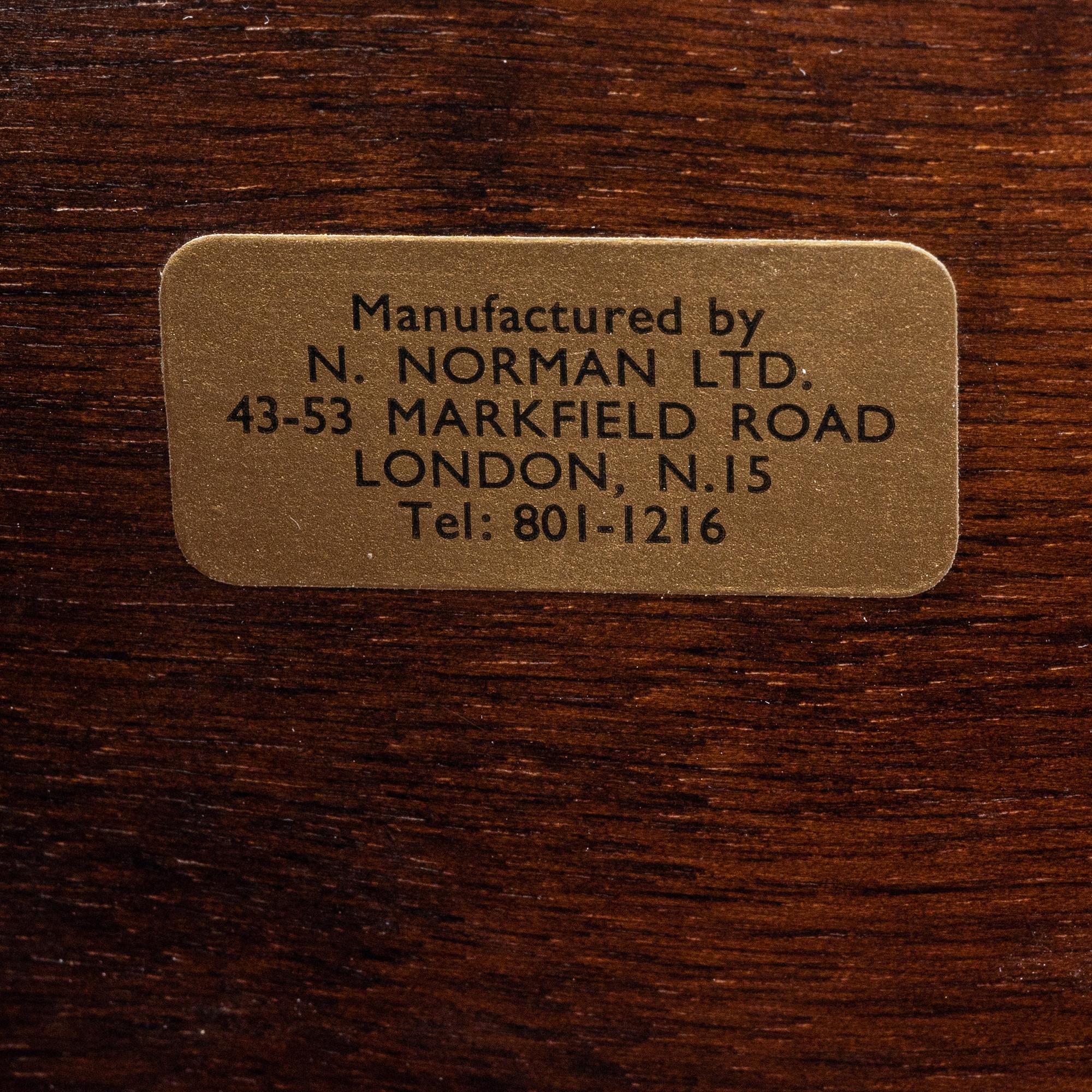 A pair of mahogany veneered bedside tables, N.Norman LTD, London, England, second half of the 20th century.