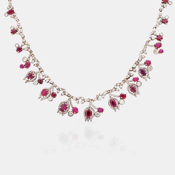 A 23.88ct ruby and brilliant cut diamond necklace. Total carat weight of diamonds 8.00cts. Mandelstam 'Stardust galaxy'.