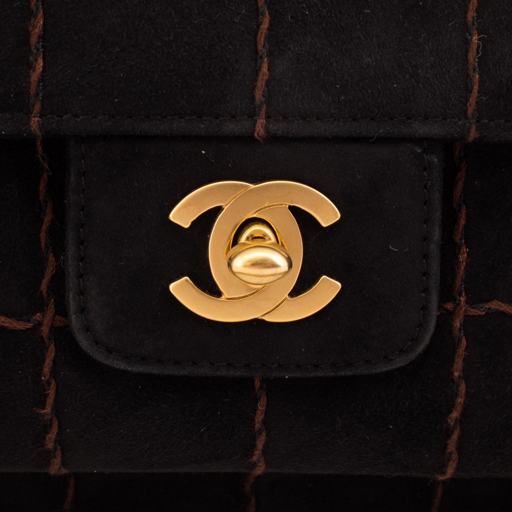 A CHOCO BAR SUEDE FLAP BAG BY CHANEL.