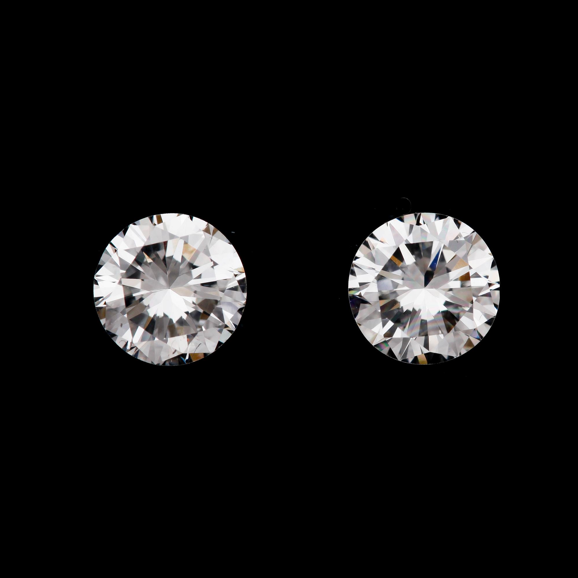 BRILLIANT CUT DIAMONDS, 2 loose stones, 0.62, 0.59 cts.