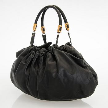 Emporio Armani, a leather bag.