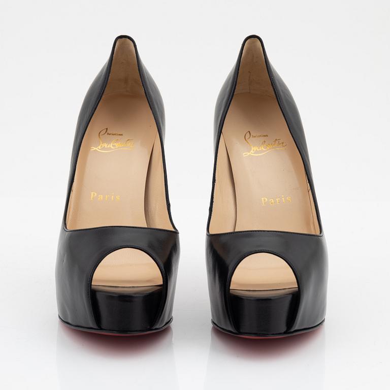 Christian Louboutin, a pair of black leather peep toe pumps, size 37 1/2.