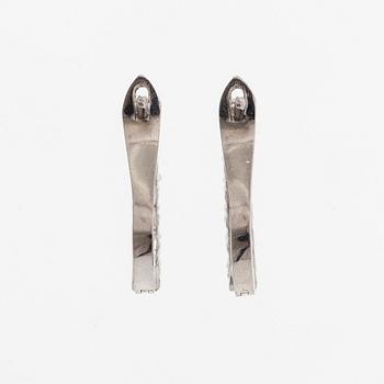 A pair of  14K gold earrings, with  brilliant-cut diamonds totalling approximately 0.56 ct.
