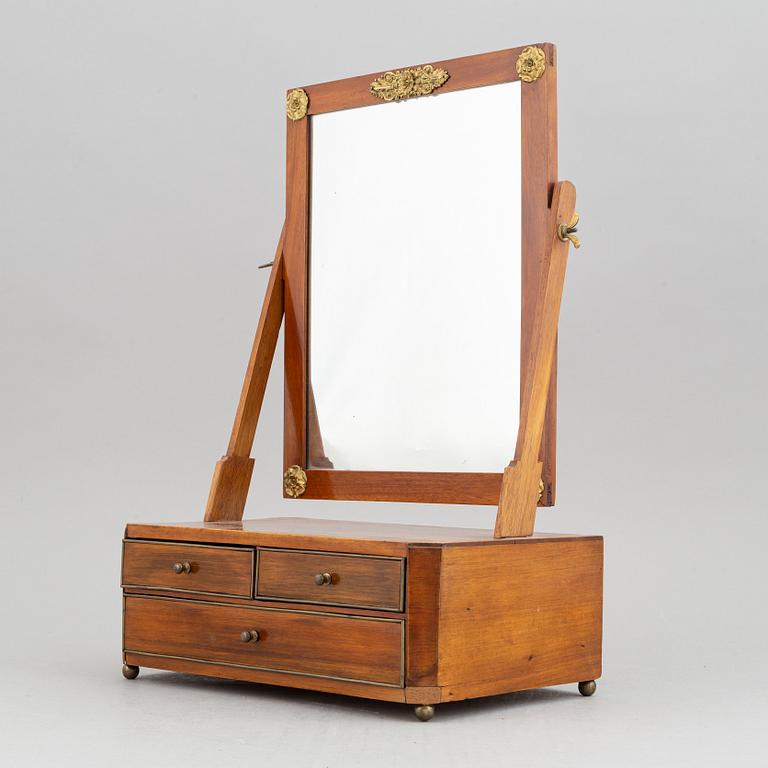 An Empire table mirror, first half of the 19th century.