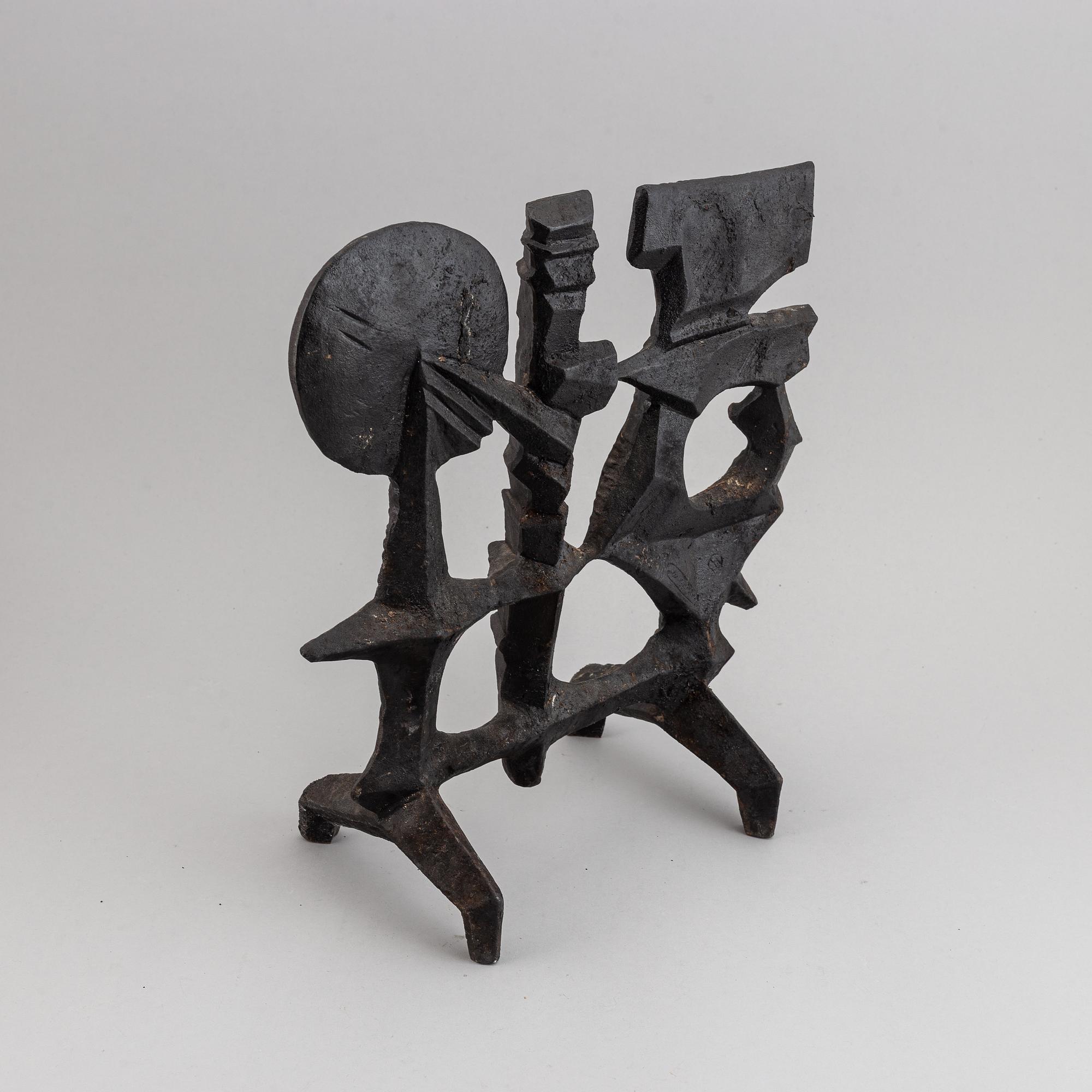 OLLE HERMANSSON, a cast iron sculpture, marked Husqvarna.