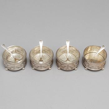 A set of four Fabergé salt-cellars and spoons, marked Moscow 1908-1917. Imperial Warrant.