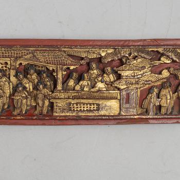 A group of three Chinese wooden panels, late Qing dynasty / around 1900.