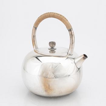A Japanese early 20th century sterling silver tea pot.