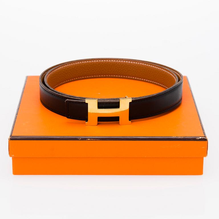 A REVERSIBLE LEATHER BELT, size 90. 2003.