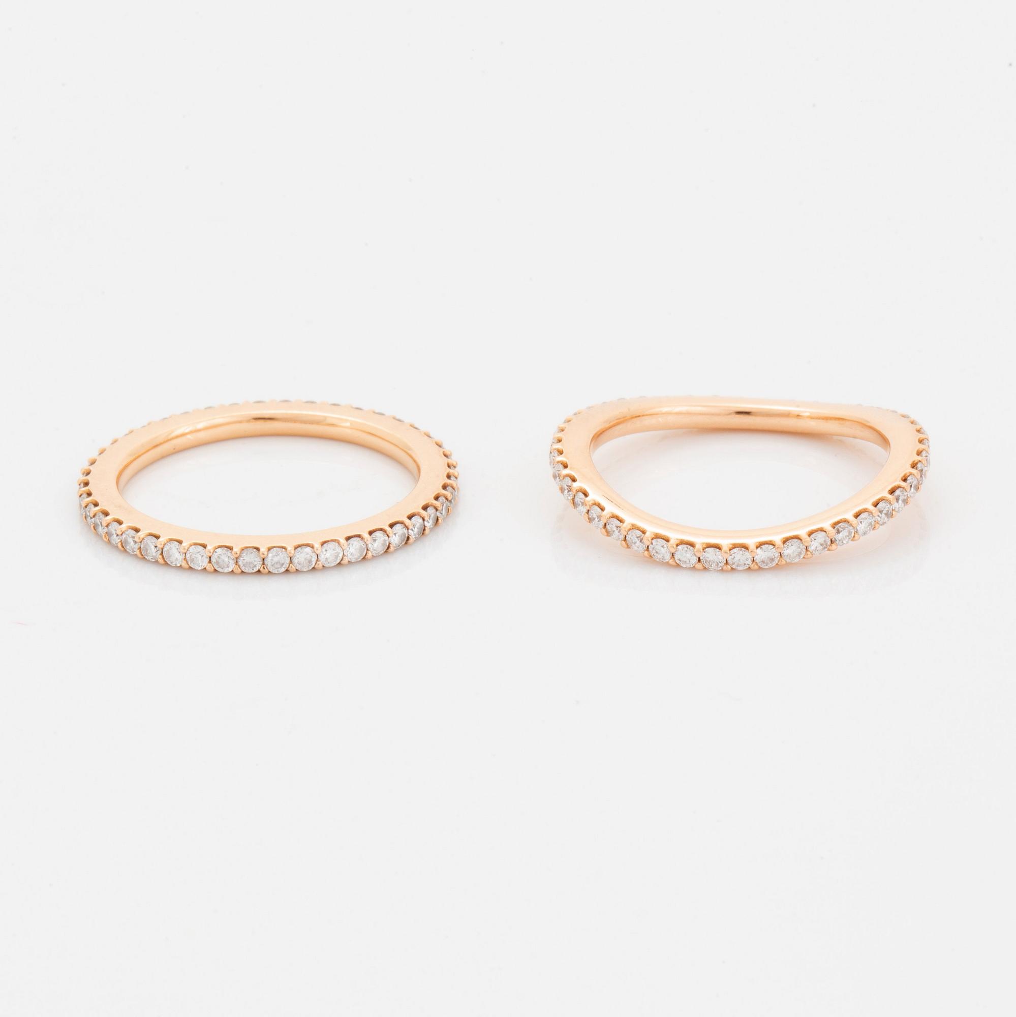 Ole Lynggaard two rings "Love" in 18K gold set with round brilliant-cut diamonds.