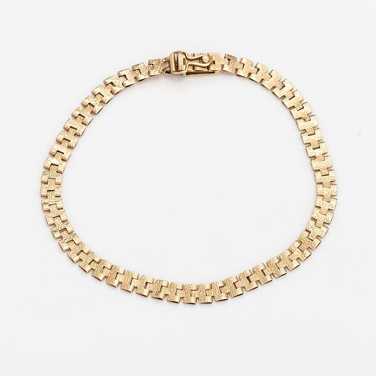 Rannekoru, 14K kultaa. Keravan Kultaseppä, Helsinki 1973.