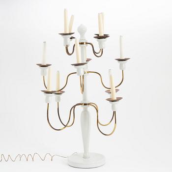 A painted wood and brass model 2586 candelabra by Josef Frank for Firma Svenskt Tenn.