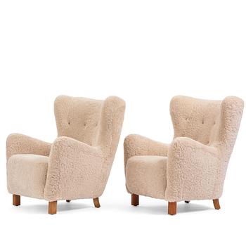 A pair of Danish Modern easy chairs, executed by cabinetmaker Peder Pedersen, Denmark 1940's.