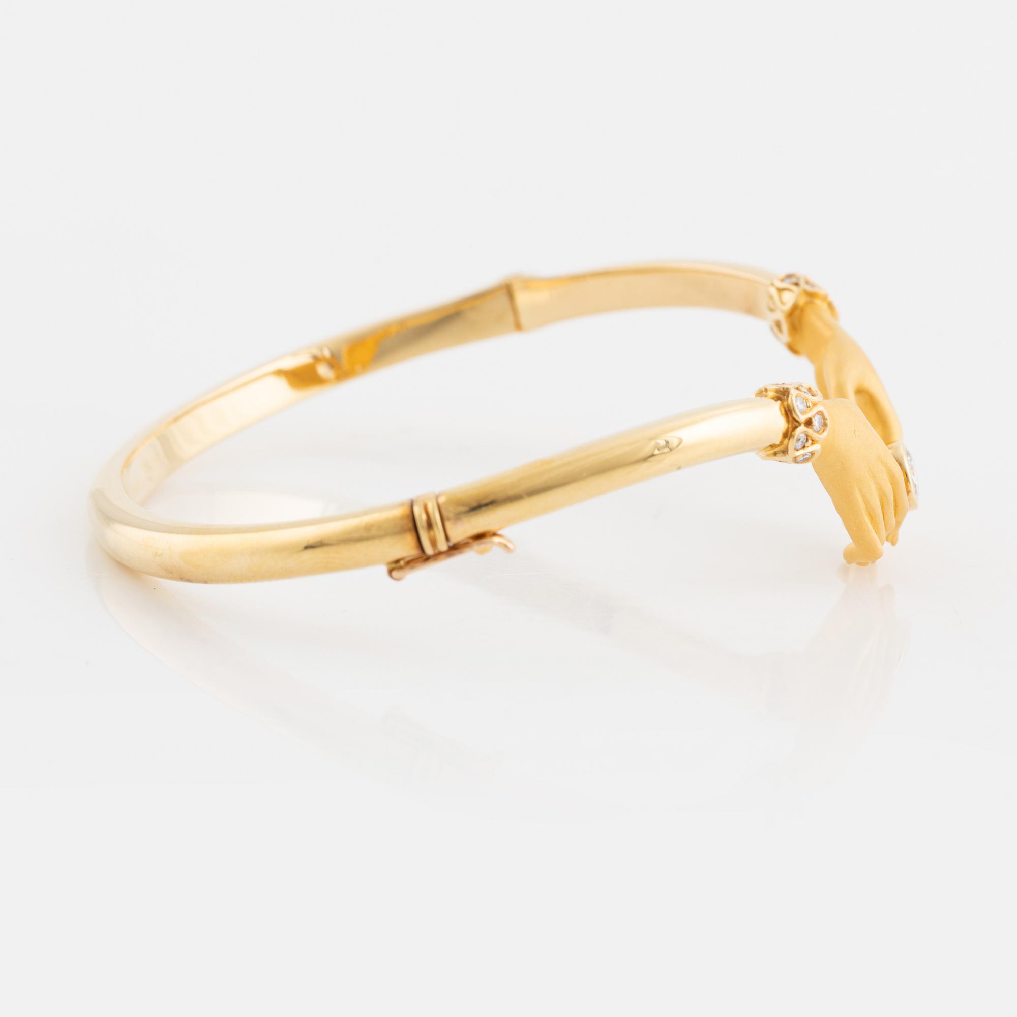 Carrera y Carrera, armring 18K guld i form av händer med briljantslipade diamanter.