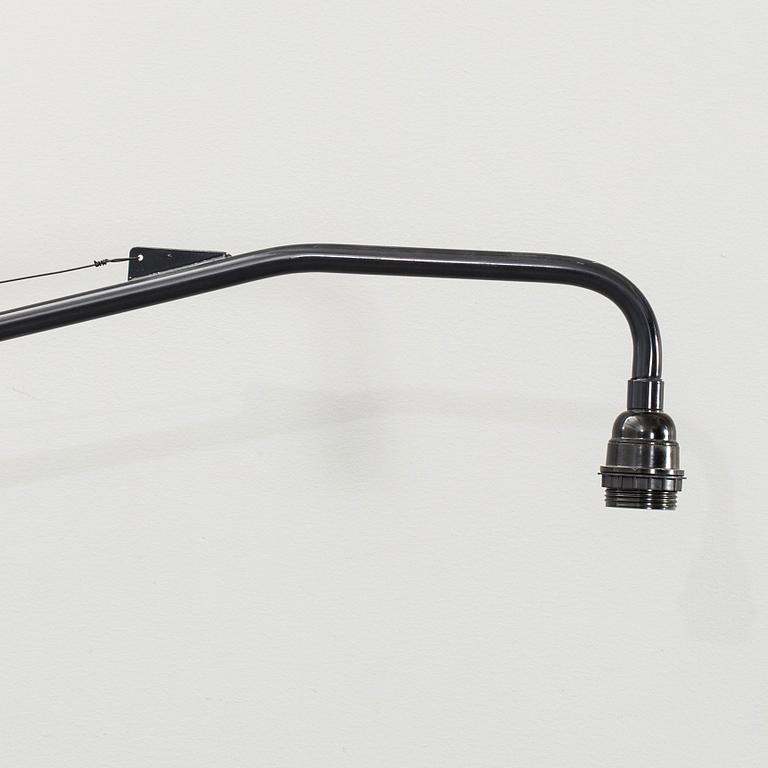 A WALL LAMP BY JEAN PROUVÉ, VITRA.