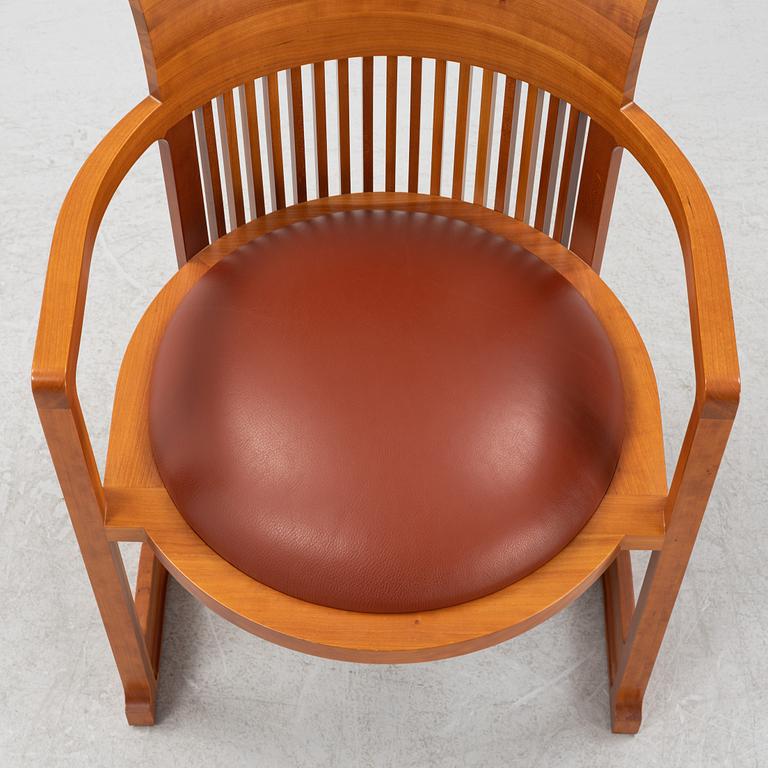 Frank Lloyd Wright, a model 606 'Barrel' chair from Cassina.