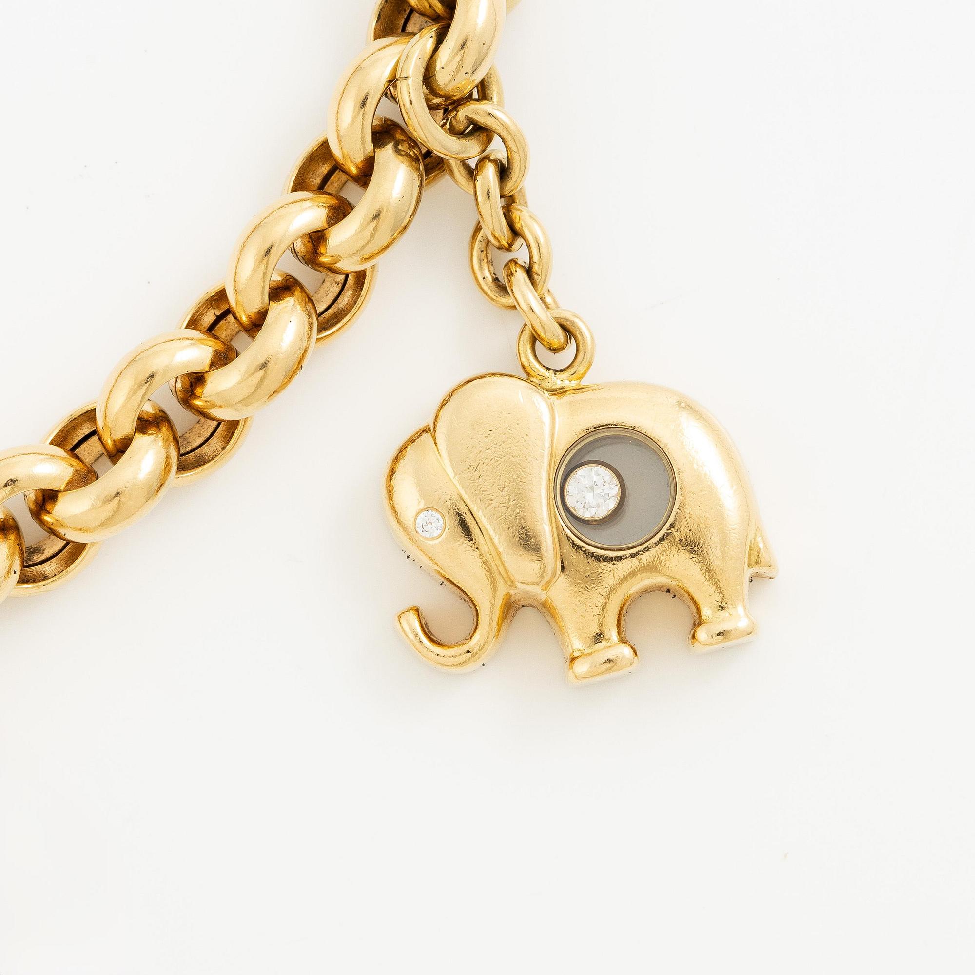 Chopard armband med berlocker 18K guld med runda briljantslipade diamanter.