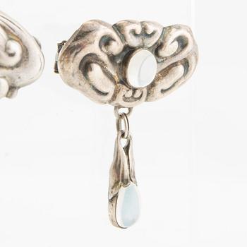 Brooches, 2 pieces, Art Nouveau, early 20th century, pewter, moonstone, and green stone.