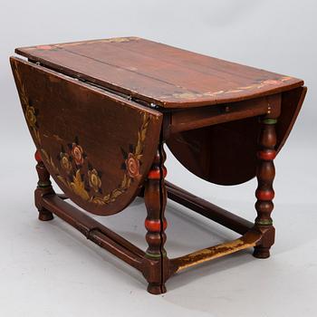 A painted 18th Century Baroque gate leg table.