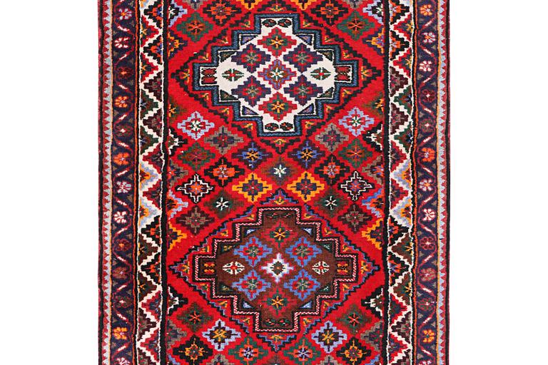 A Hamadan runner carpet, c. 385 x 86 cm.