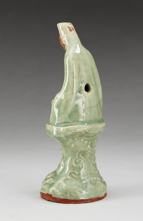 A celadon glazed figure of Guanyin, Ming dynasty.
