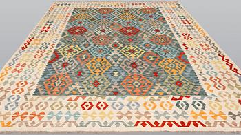 A Kelim carpet, c. 354 x 250 cm.