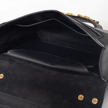 Christian Dior, A black leather "Dio(r)evolution" bag.