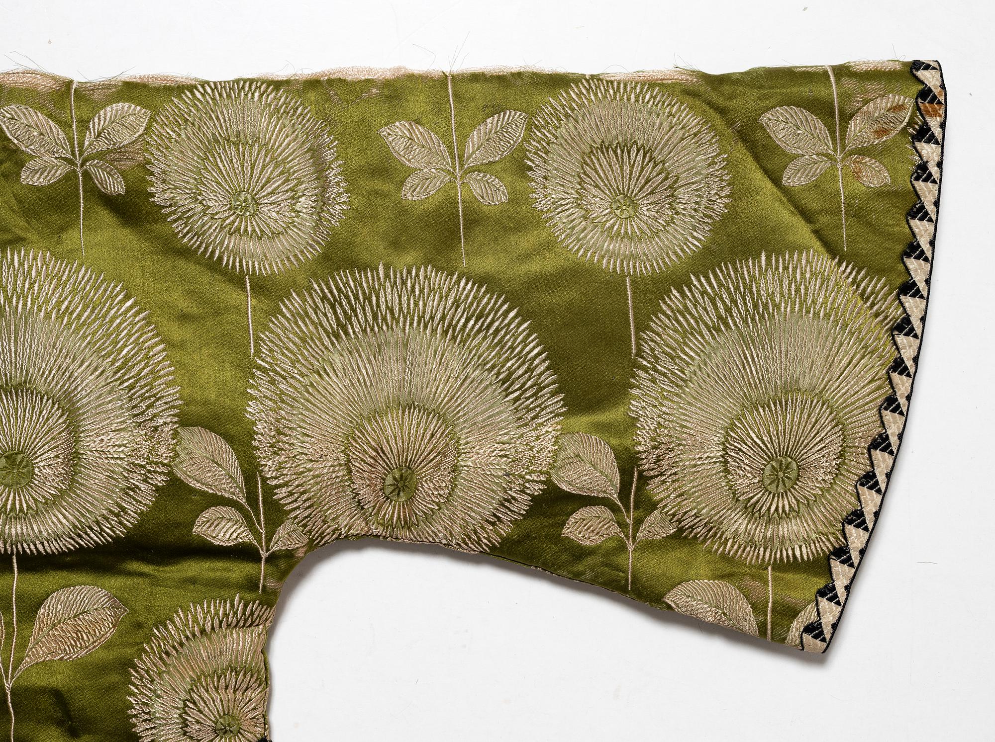 A Japanese silk brocade and fur childrens jacket, Meiji (1868-1912).