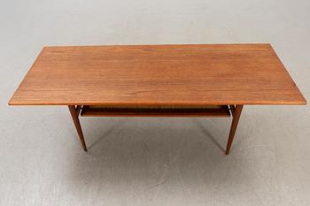 A Dansih 1960s teak and rattan  coffee table.