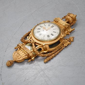 A gustavian style wall clock, signed Rob. Engström, Stockholm. First half of the 20th century.