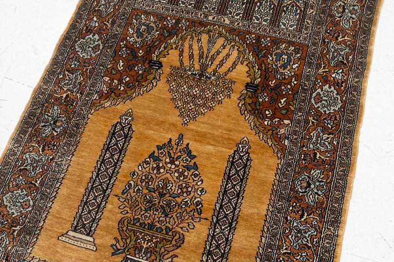 A silk Quum rug, c. 125 x 75 cm.