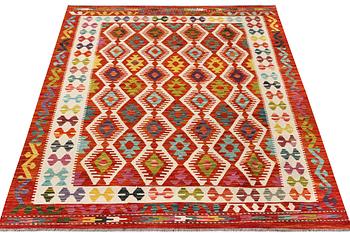A Kilim rug, c. 242 x 181 cm.