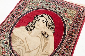 An antique pictoral Kerman Raver rug, c. 87 x 65 cm.