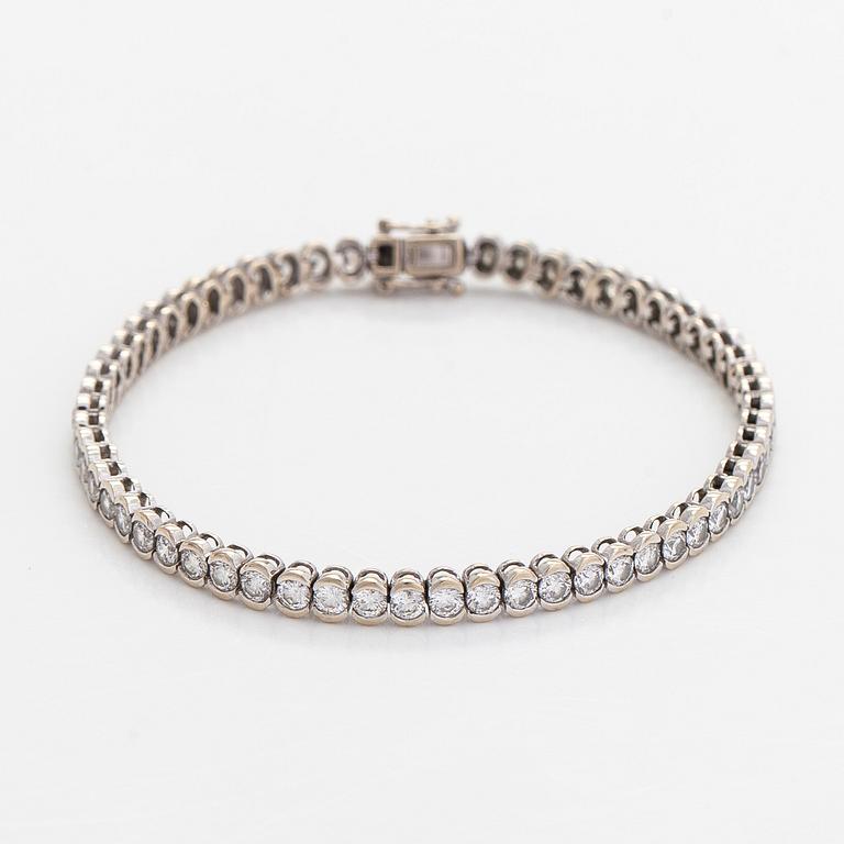 Tennisrannekoru, 18K valkokultaa, briljanttihiottuja timantteja.