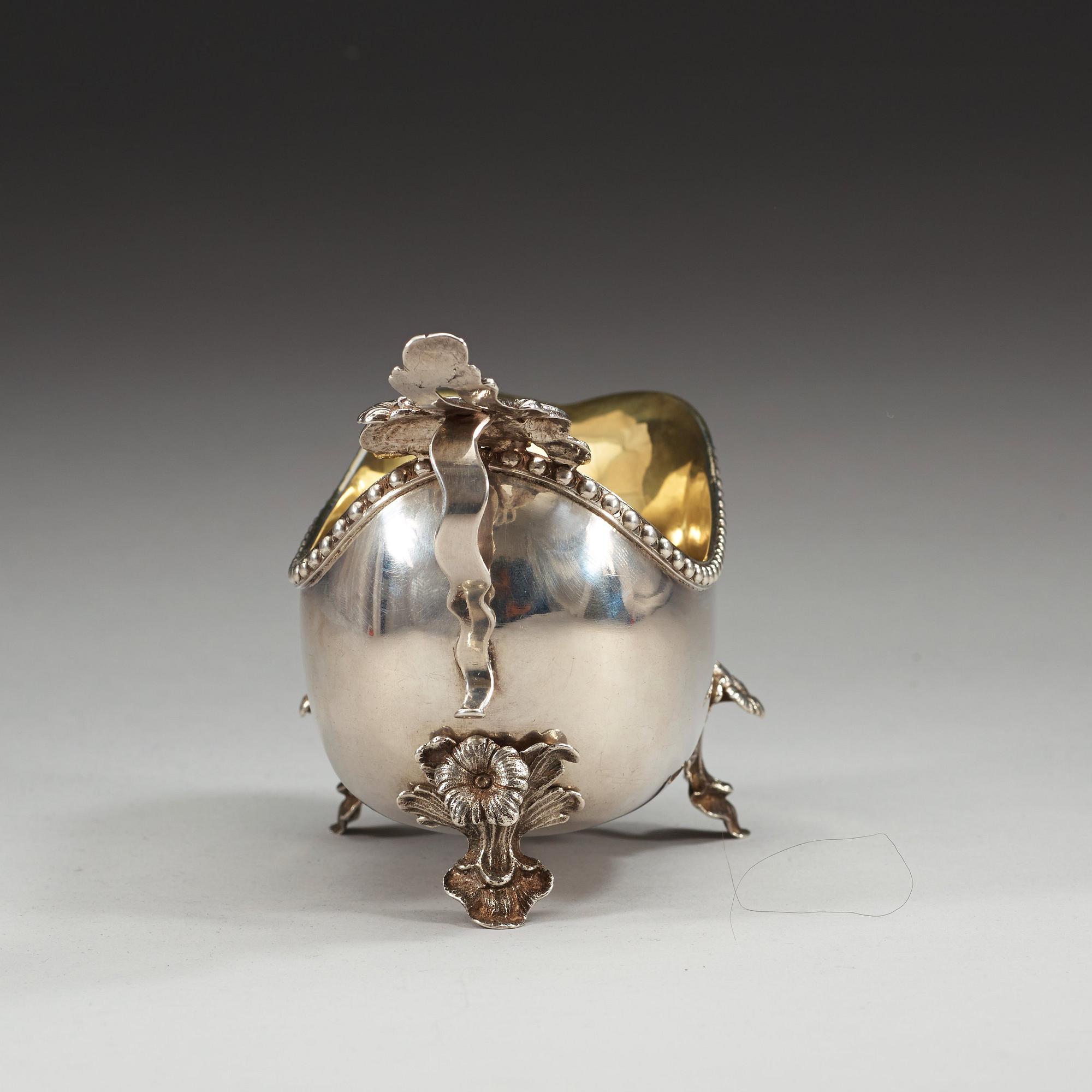 A Swedish 18th century parcel-gilt cream-jug, marks of Petter Norlin, Malmö 1784.