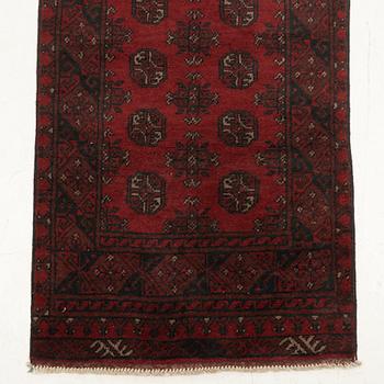 An oriental / Afghan runner, approx. 478 x 81 cm.