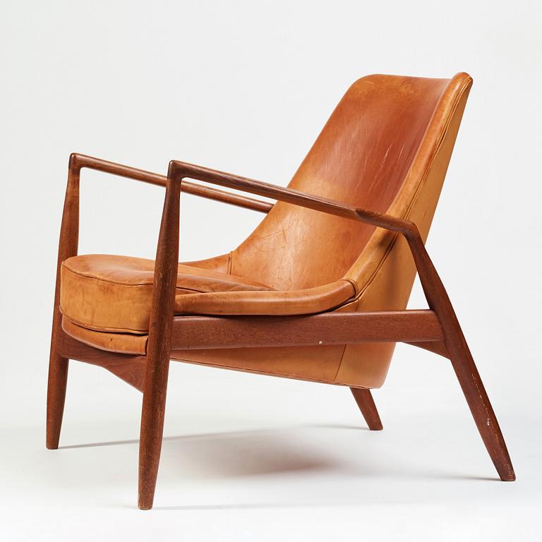 Ib Kofod-Larsen, a "Seal" teak and brown leather armchair, Olof Persson Möbler, Jönköping, Sweden 1950-60's.