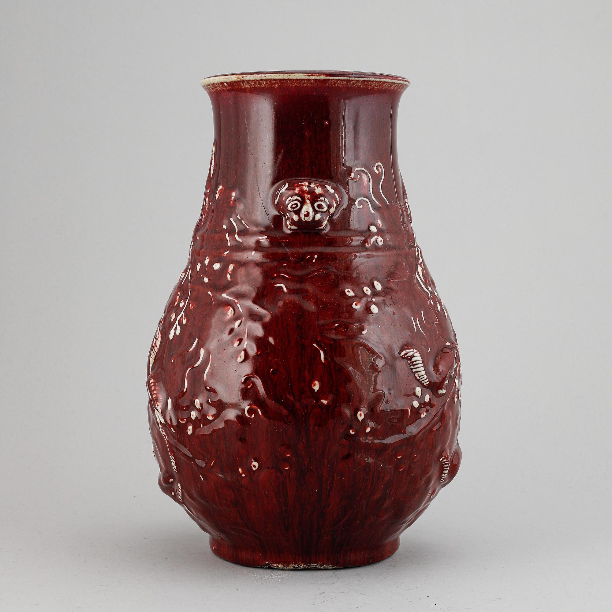 A red glazed Chinese vase, 20th century.