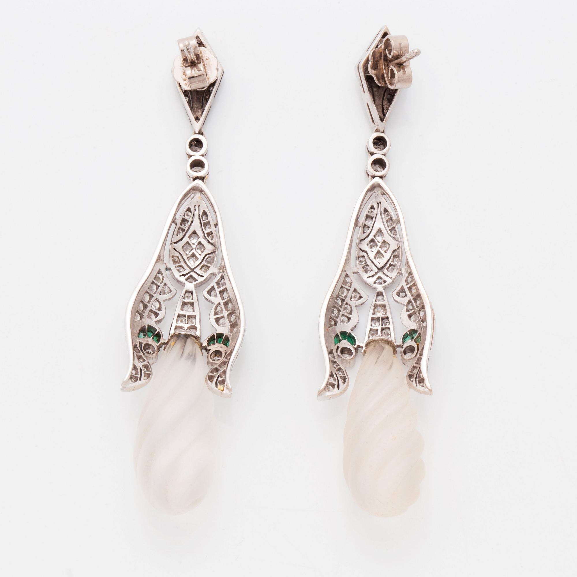 A pair of 18K white gold earrings with rock crystal drops.